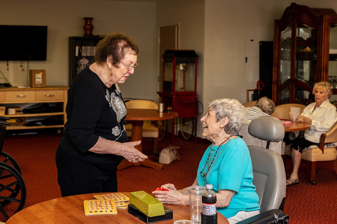 Residents enjoying a game of bingo in a common area