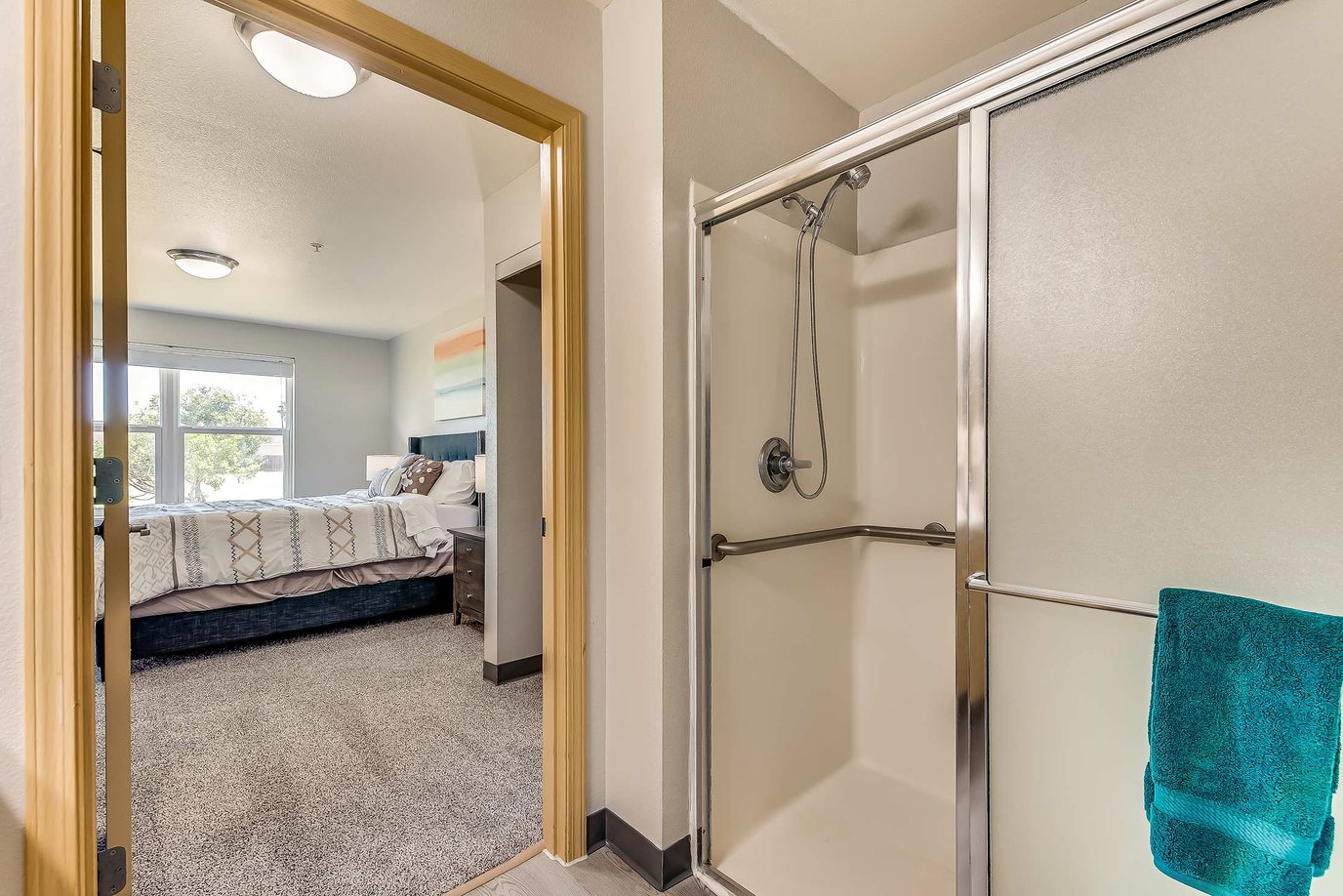 Interior view of a resident bathroom and bedroom