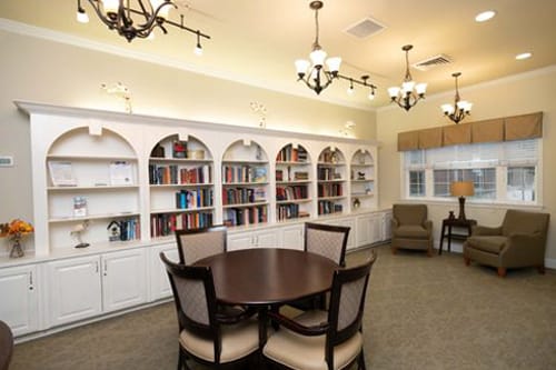 Bright common area with bookshelves and seating