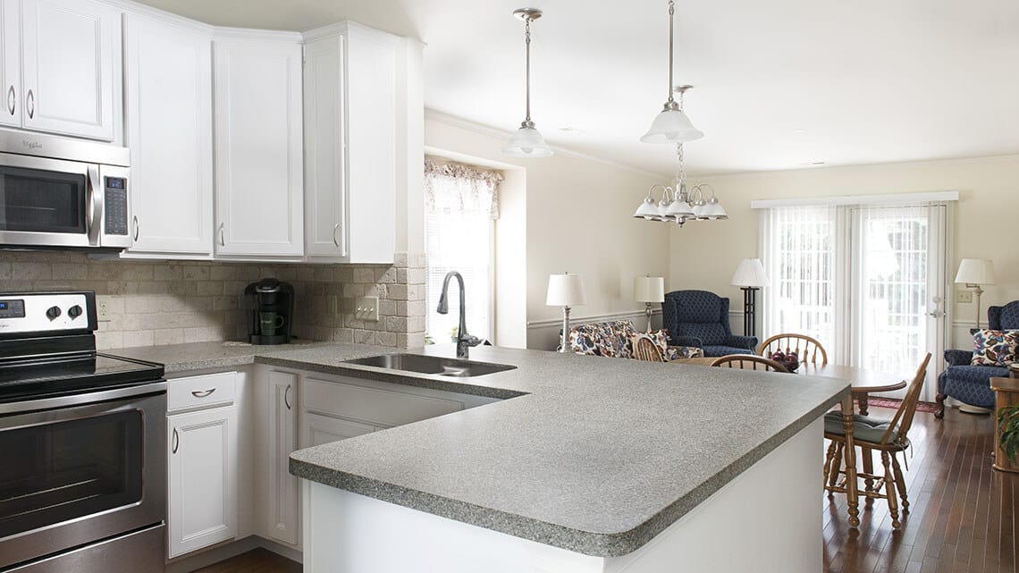 Bright kitchen area with seating and living space