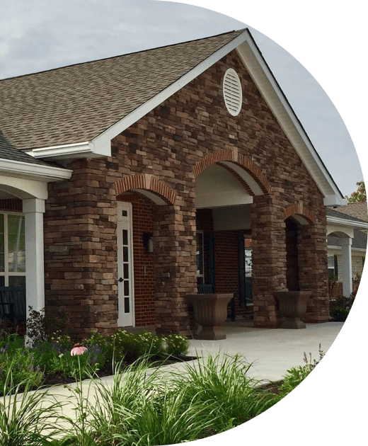 Exterior view of the senior living facility with landscaping