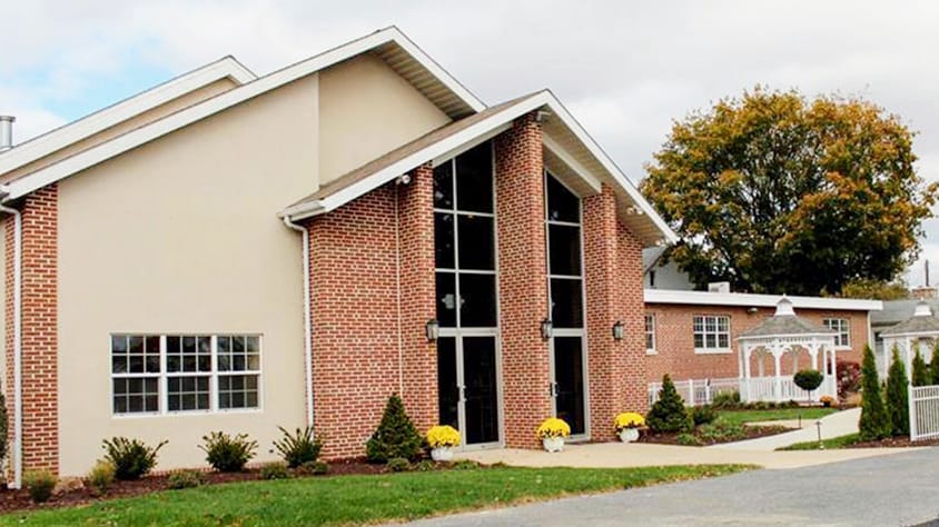 Exterior view of Palmyra Senior Living facility