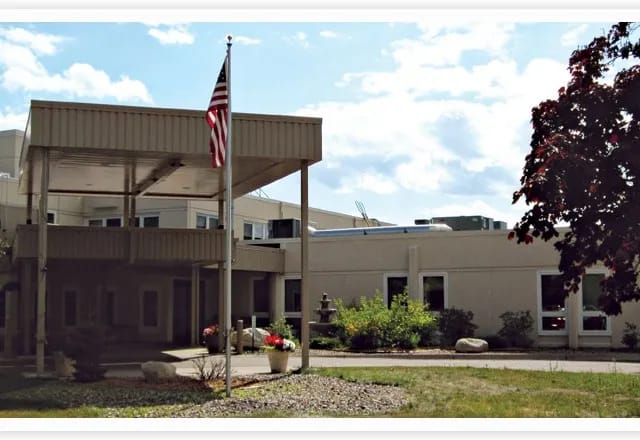 Entrance of a senior living facility with landscaped front