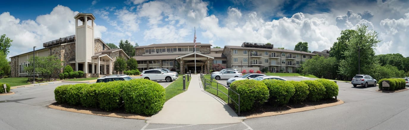 Exterior view of the Avina Milwaukee facility with landscaped entrance