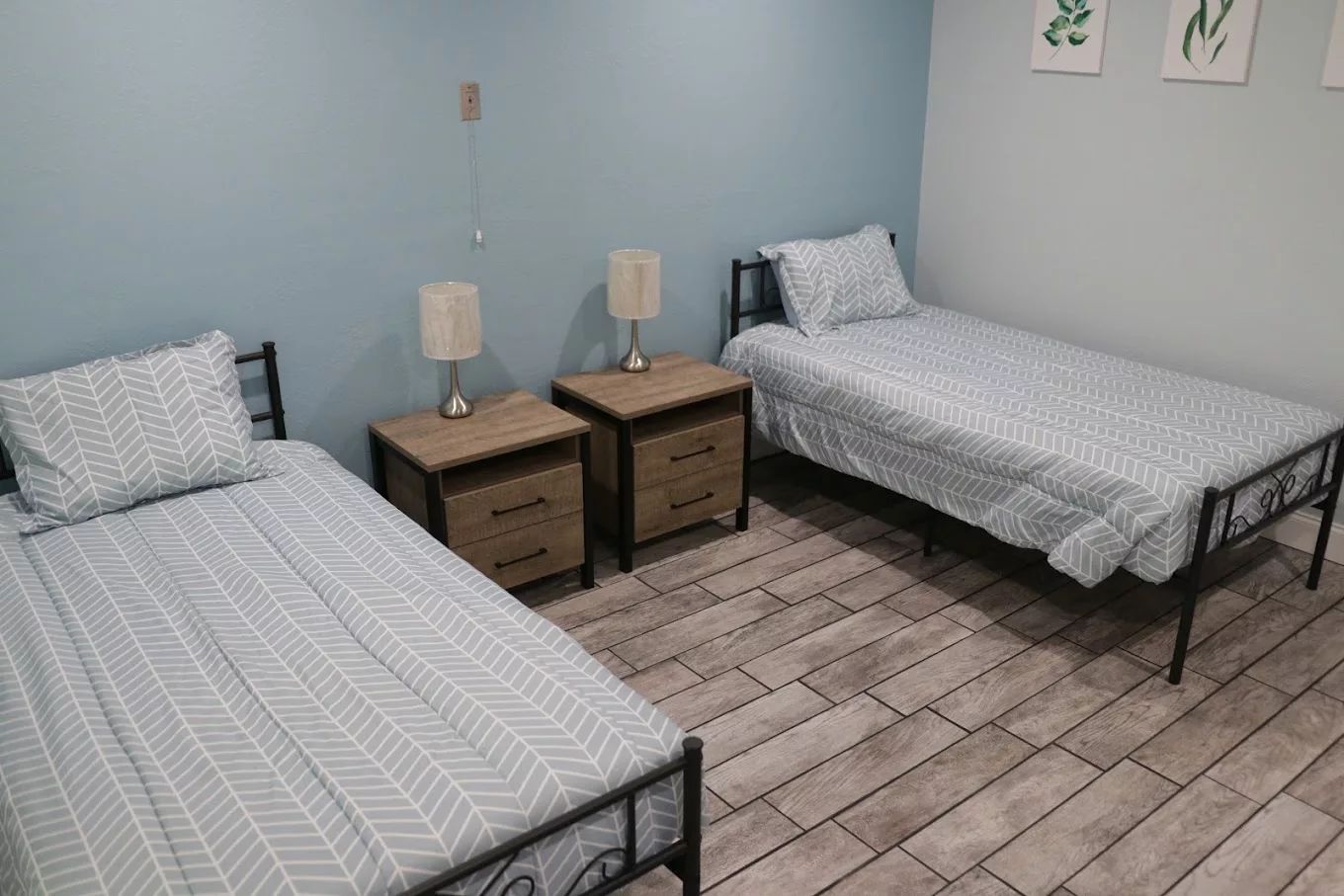 Simple resident room with twin beds and nightstands