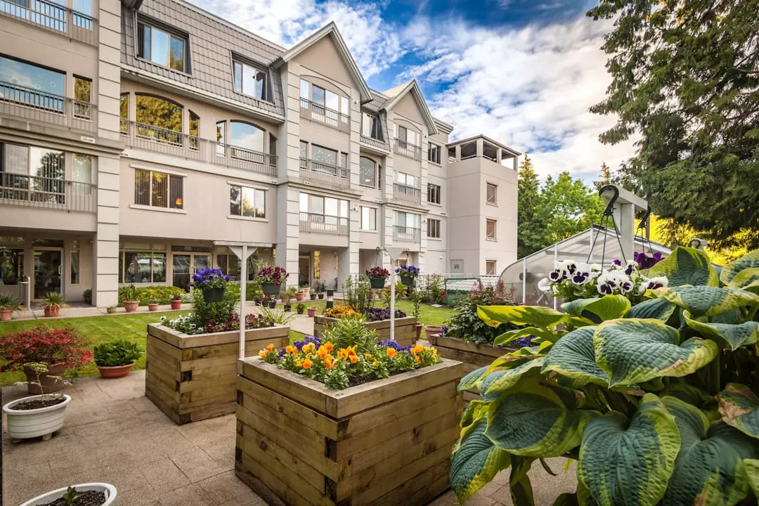 Exterior view of a residence with vibrant gardens