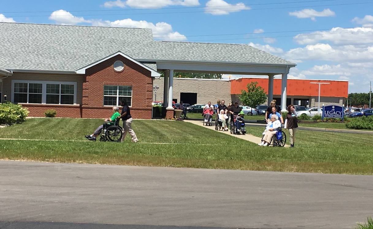 Residents and staff enjoying the outdoor space