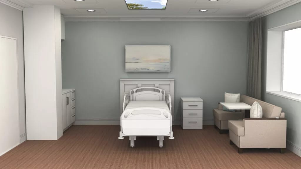 A furnished resident room with a hospital bed and seating area