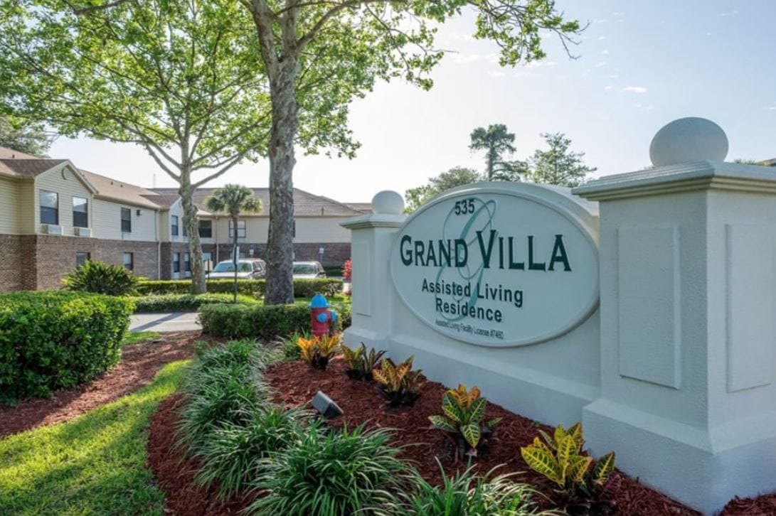 Exterior view of Grand Villa assisted living residence sign
