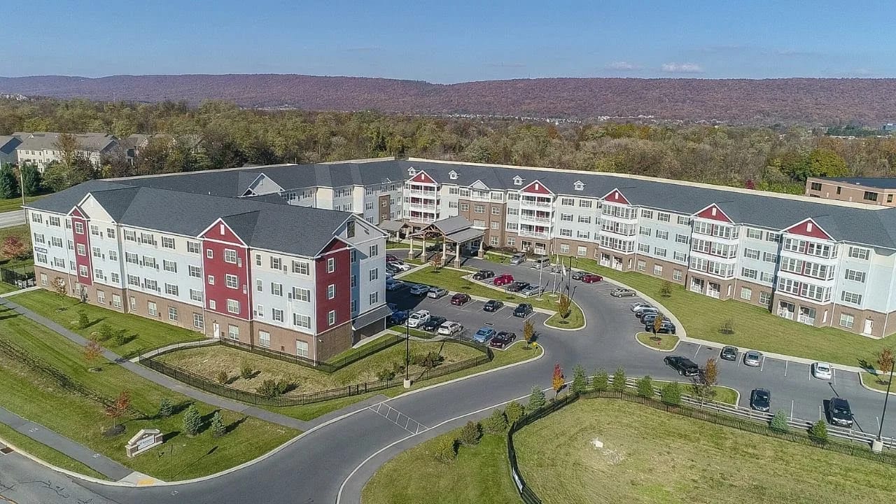 Aerial view of the Harmony at West Shore facility with surrounding landscape