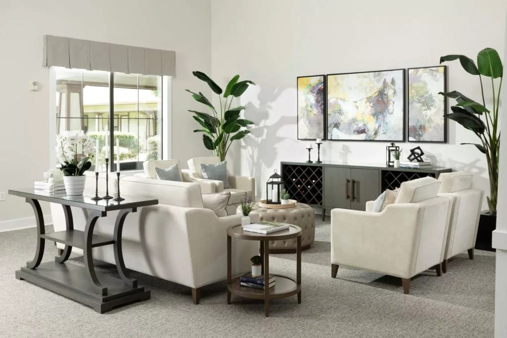 Bright and welcoming living room with comfortable seating and decorative plants.