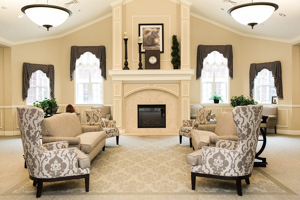 Cozy lounge with upholstered chairs and a fireplace