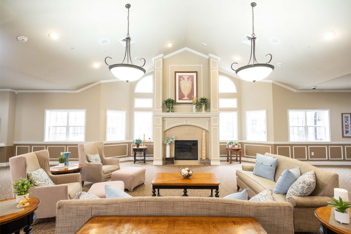Cozy lounge with seating and decorative elements in a senior living facility