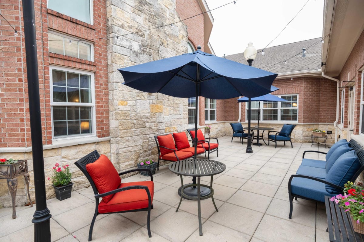 Cozy outdoor patio with seating and umbrellas