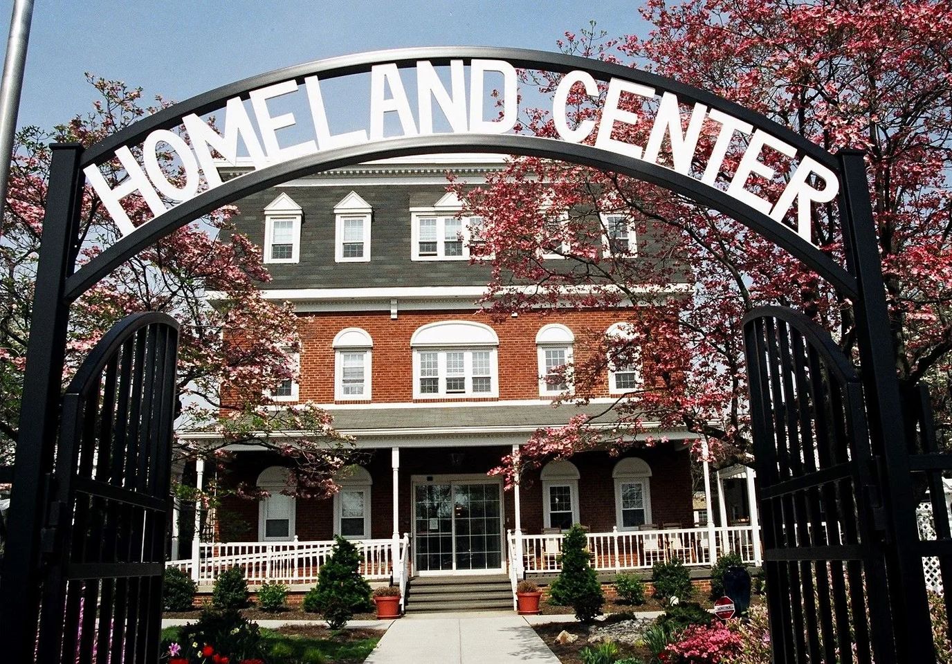 Entrance gate of Homeland Center surrounded by flowers