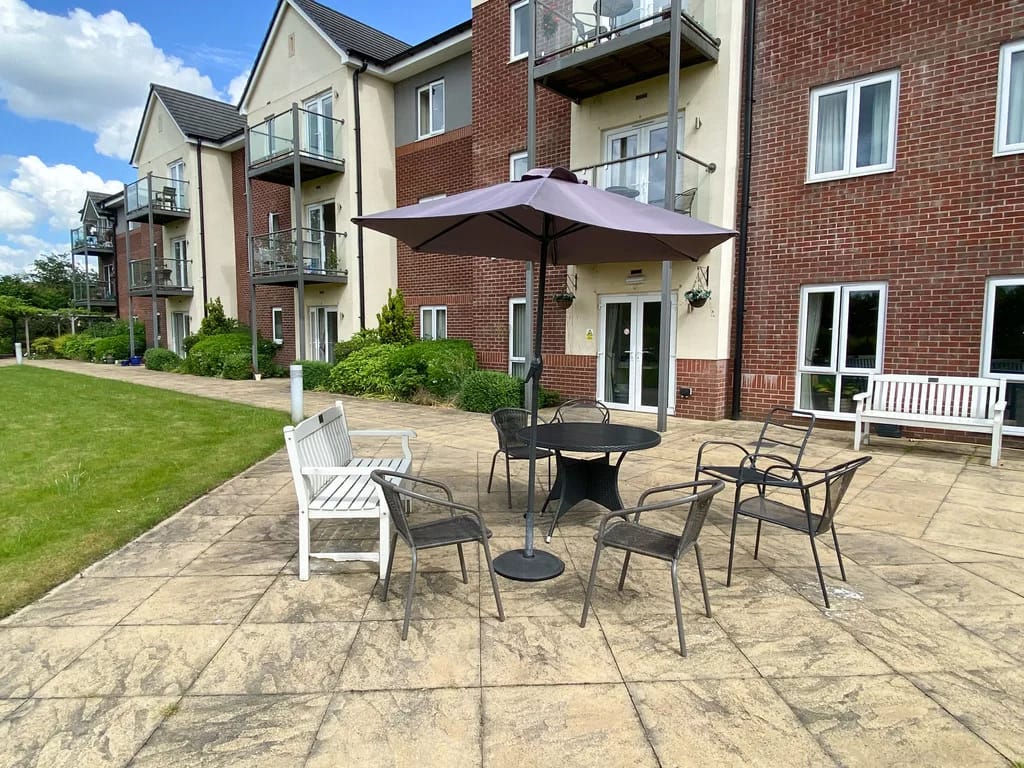 Outdoor seating area with an umbrella and chairs