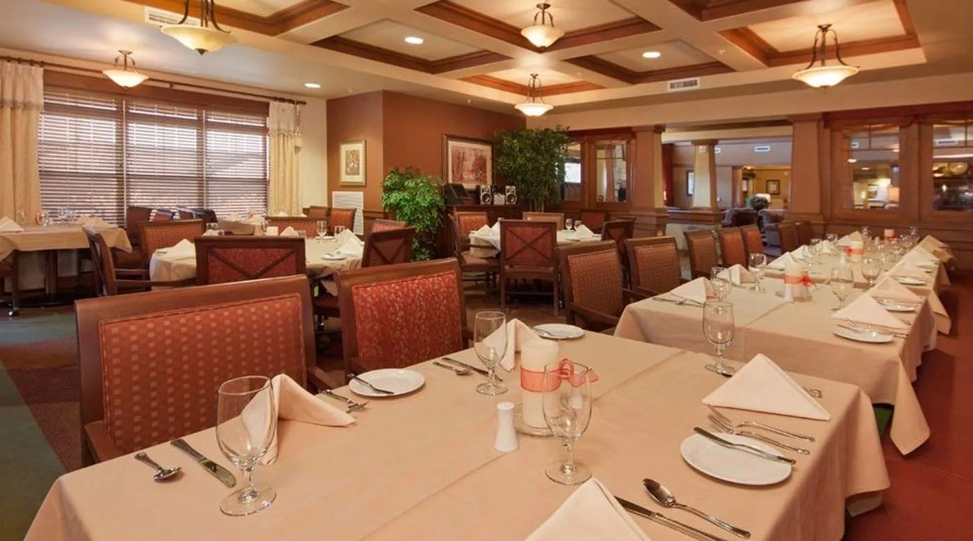 Elegant dining room with tables set for a meal
