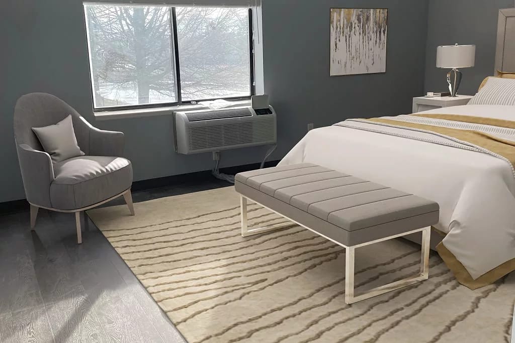 Bright interior of a resident room with seating area