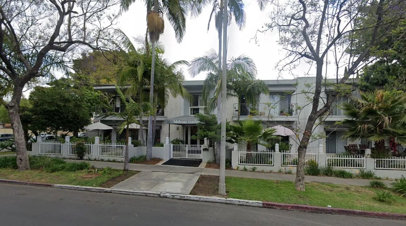Exterior view of Melrose Gardens with trees and landscaping