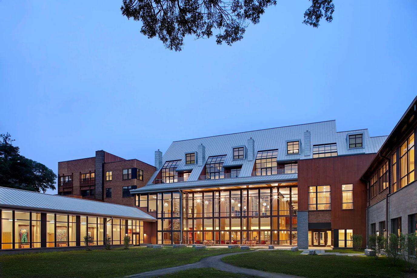 Exterior view of NewBridge on the Charles facility at dusk