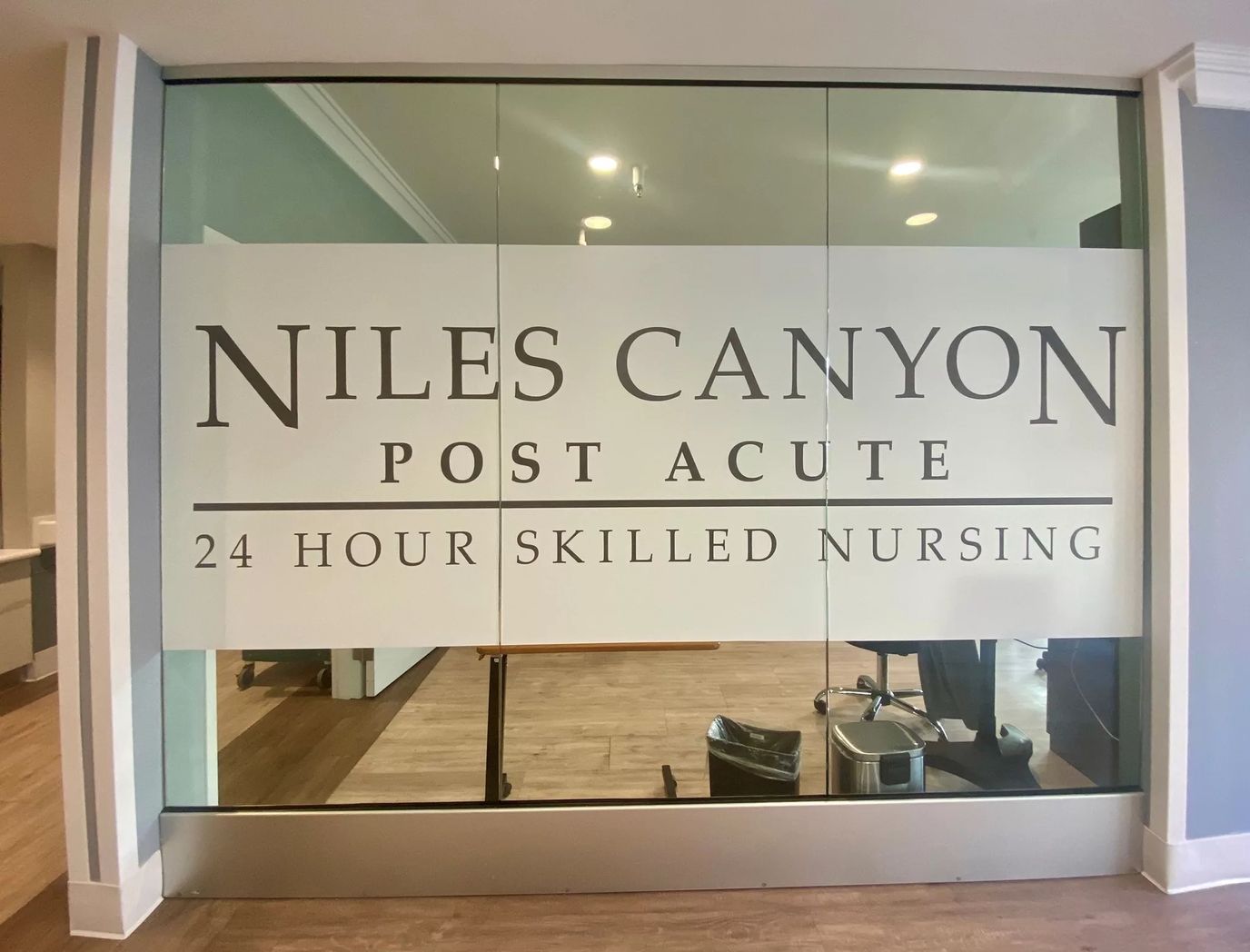 Glass entrance with facility name and services
