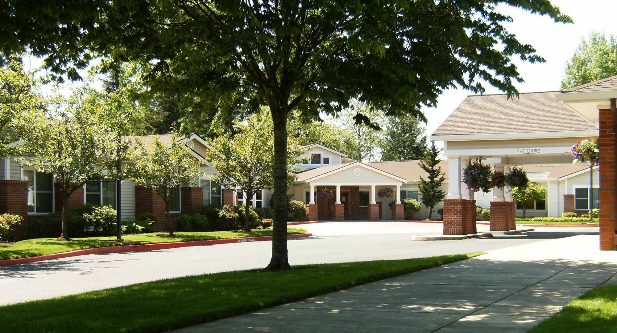Outdoor view of the assisted living facility with trees
