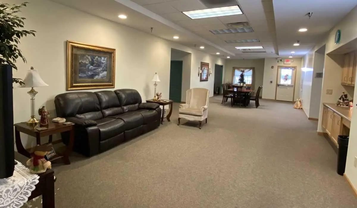 Spacious common area with seating and dining table.