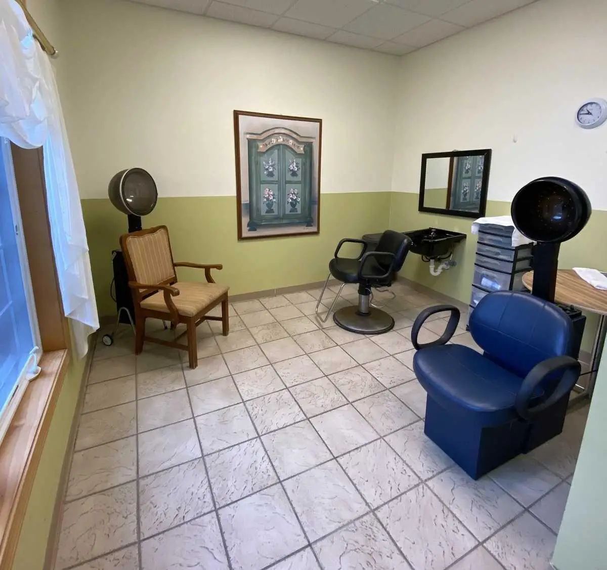 Interior of hair salon with styling chairs and a mirror