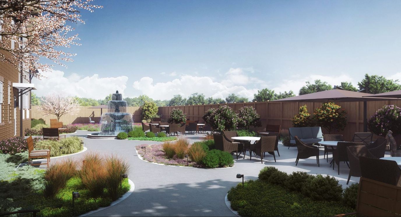 Outdoor garden area with seating and a fountain