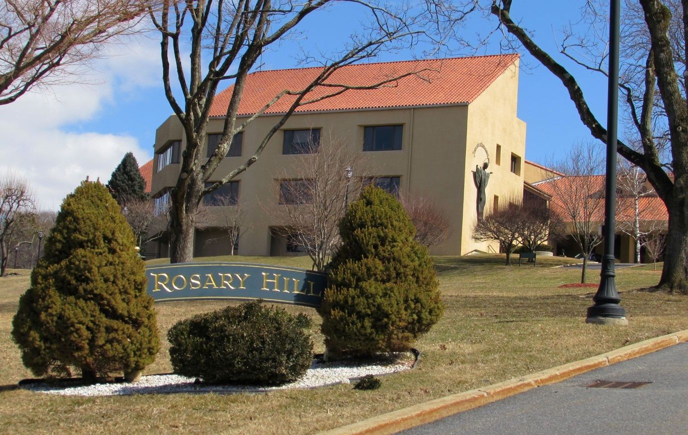 Exterior view of Rosary Hill Home building with landscaping