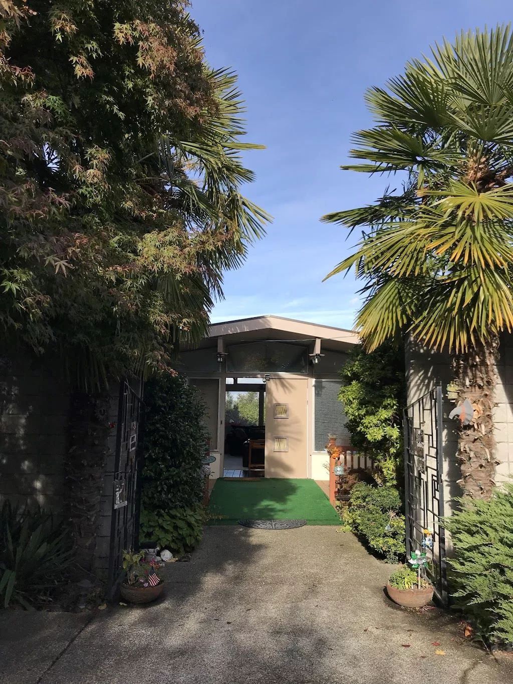 Entrance pathway surrounded by greenery