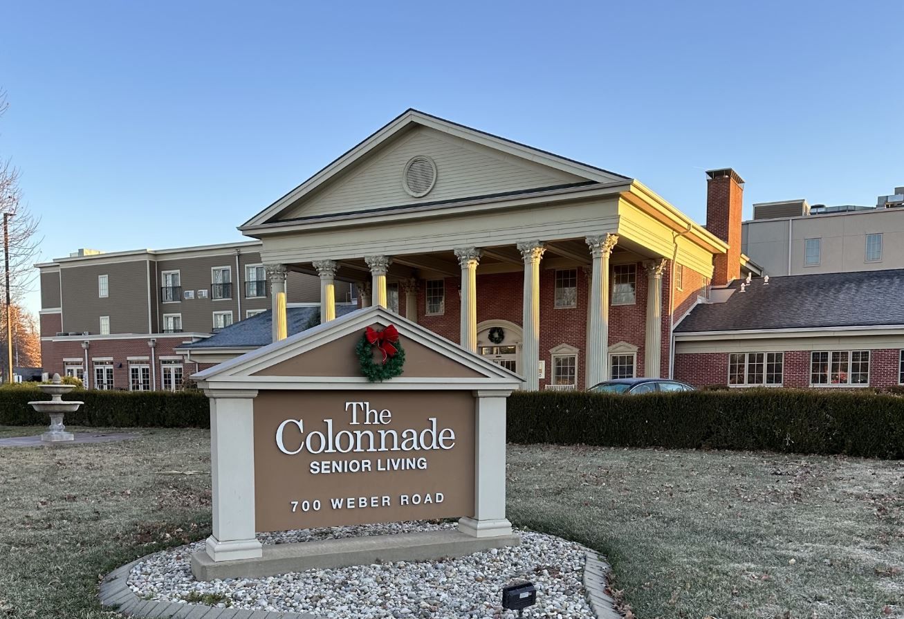 Exterior view of The Colonnade Senior Living facility