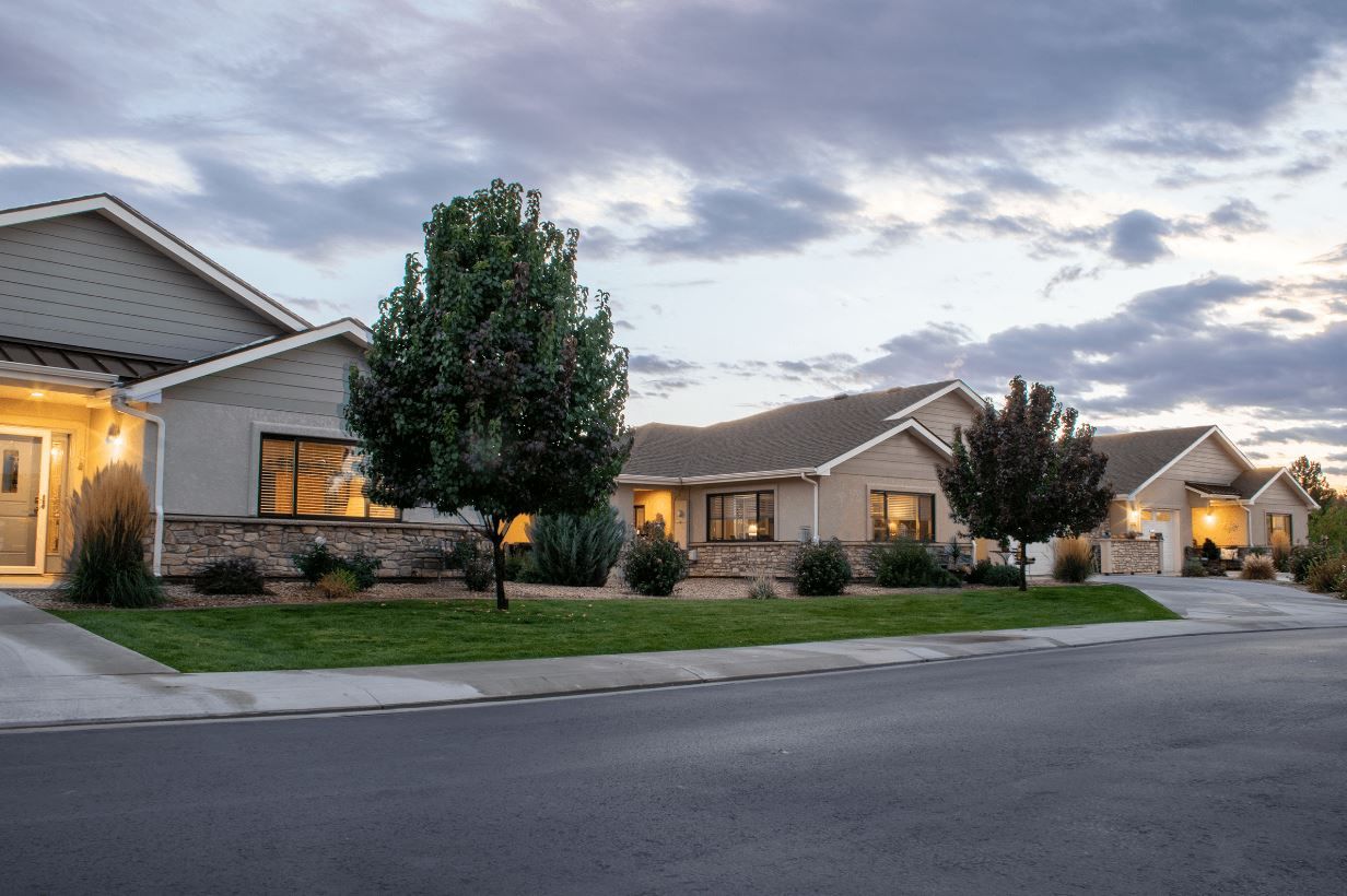 Exterior view of The Cottages of Hilltop at dusk