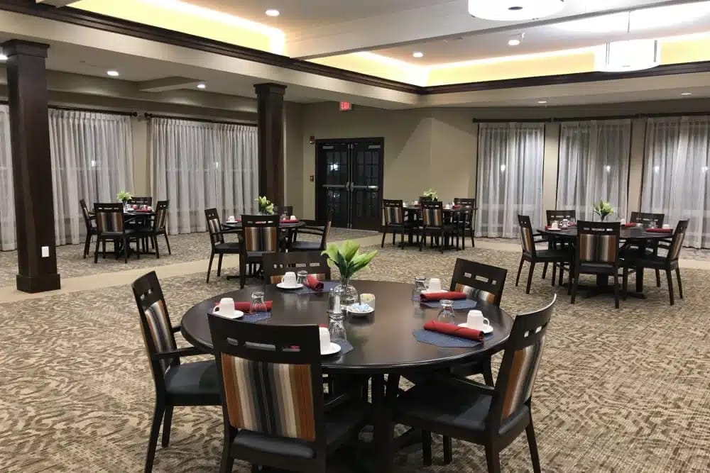 Spacious dining area with tables set for meals.