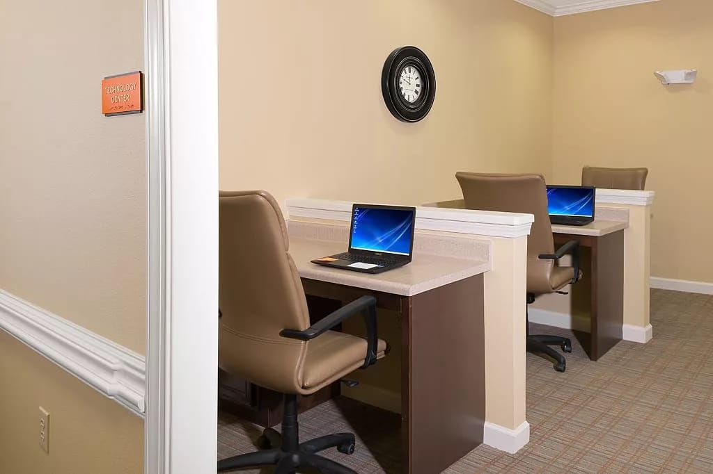 Technology center with two workstations and computers