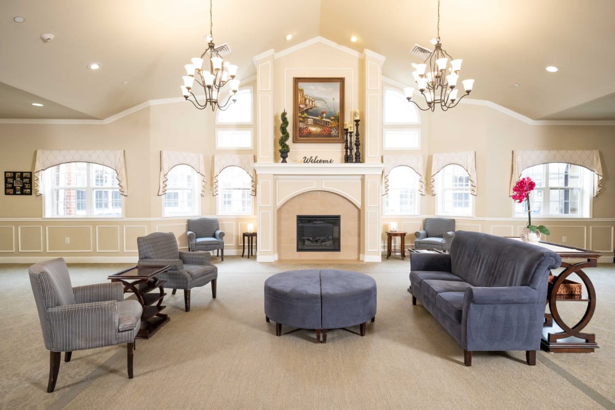 Spacious and inviting living room with seating and a fireplace