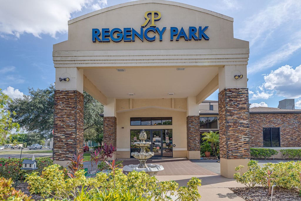 Front entrance of Regency Park with logo