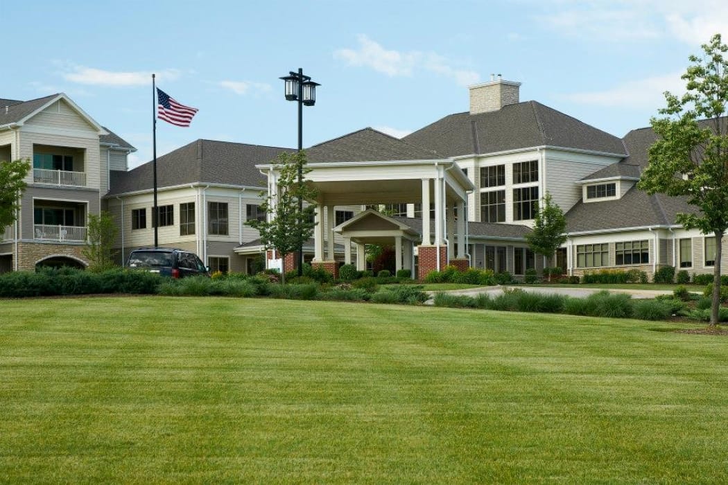 Exterior view of the senior living facility with landscaping