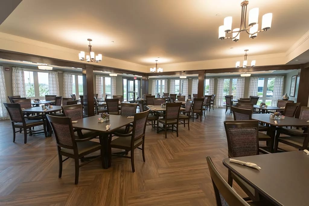 Sunny dining room with tables and chairs