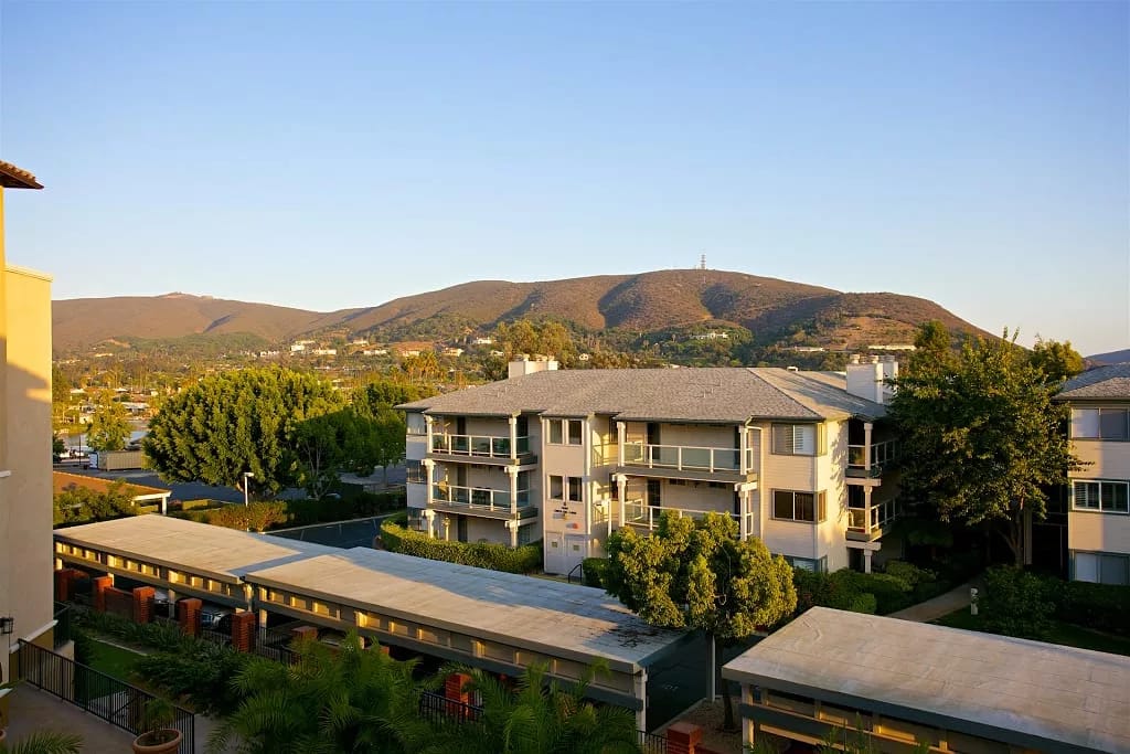 View of the facility exterior with mountains in the background