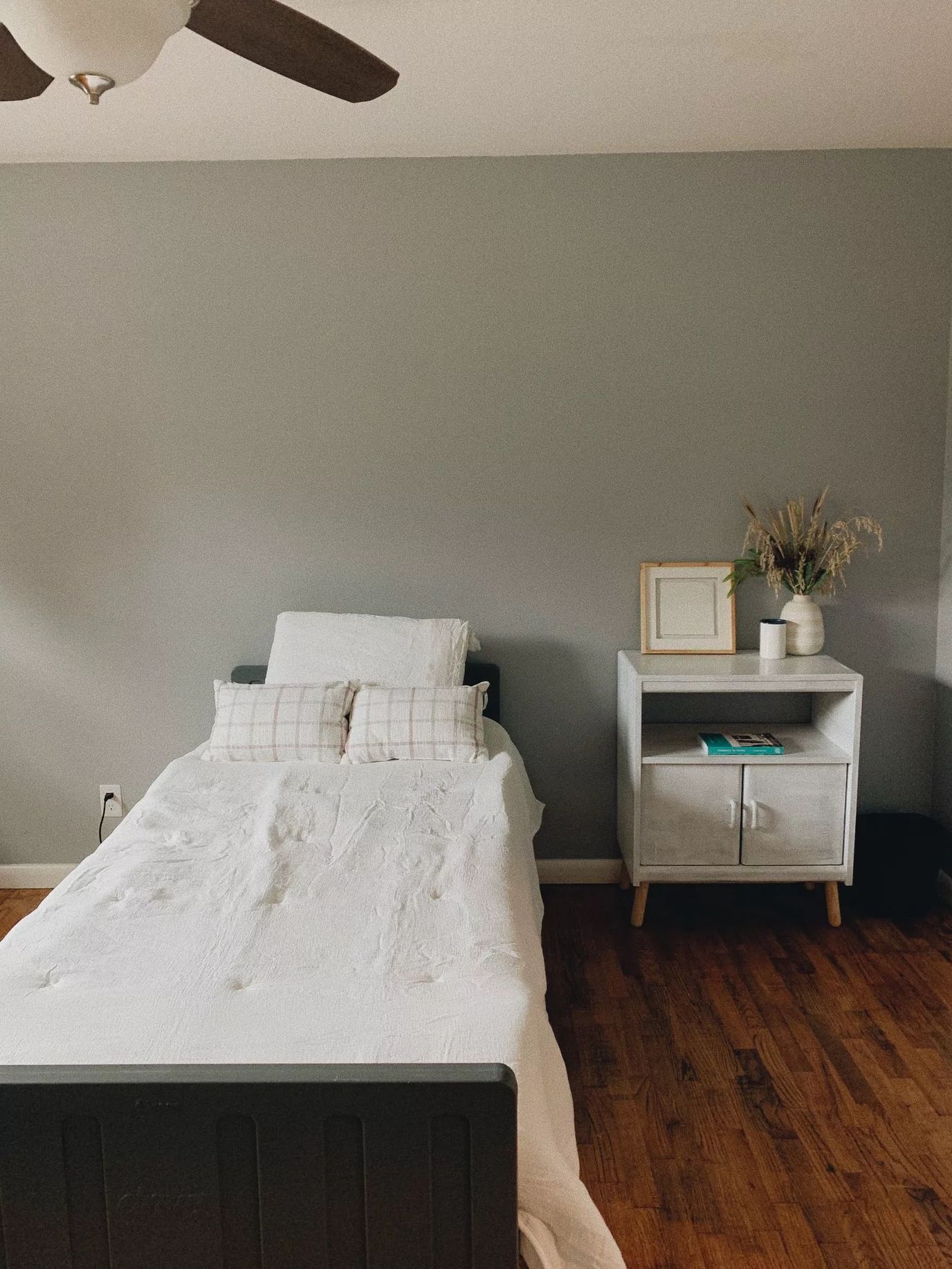 Cozy resident room with a bed and nightstand