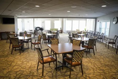 Bright, spacious dining area with tables and chairs