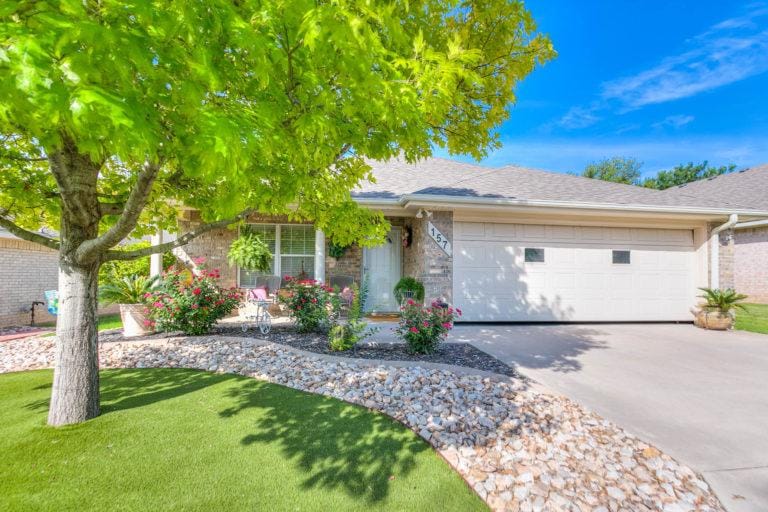 Baptist Retirement Community, nursing home in San Angelo, TX — Well-maintained residential home with landscaped front yard