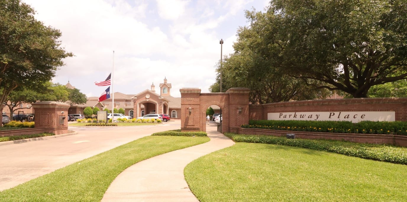 Entrance of Parkway Place with well-manicured landscaping