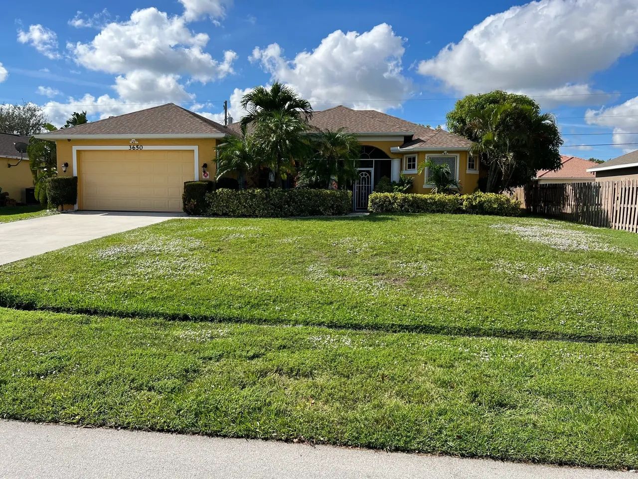 Exterior view of a residential building with well-kept lawn