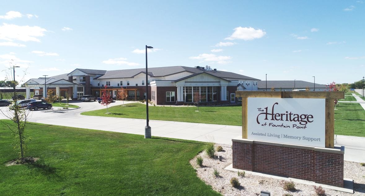 Exterior view of The Heritage at Fountain Point with green space