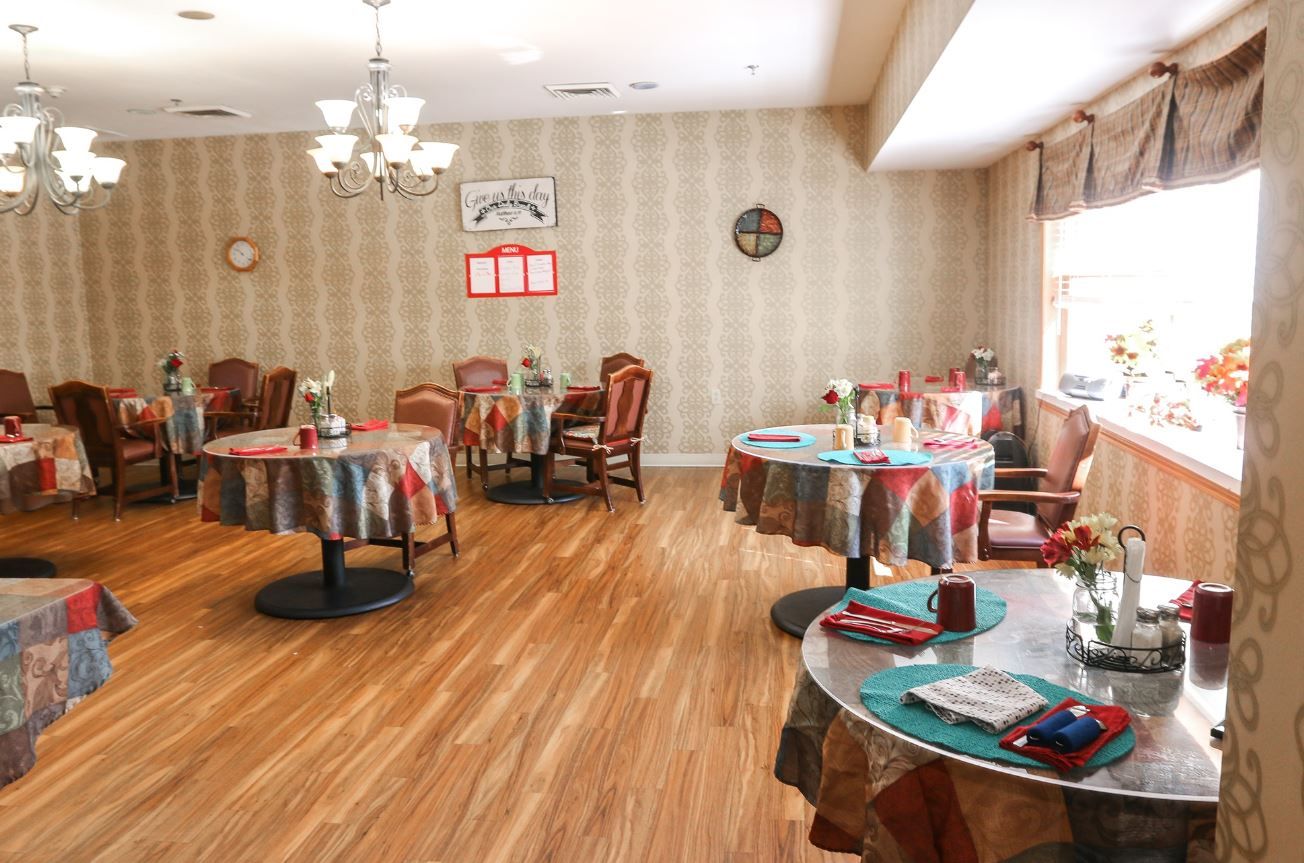 Bright dining area with tables and chairs at Vintage Park at Louisburg