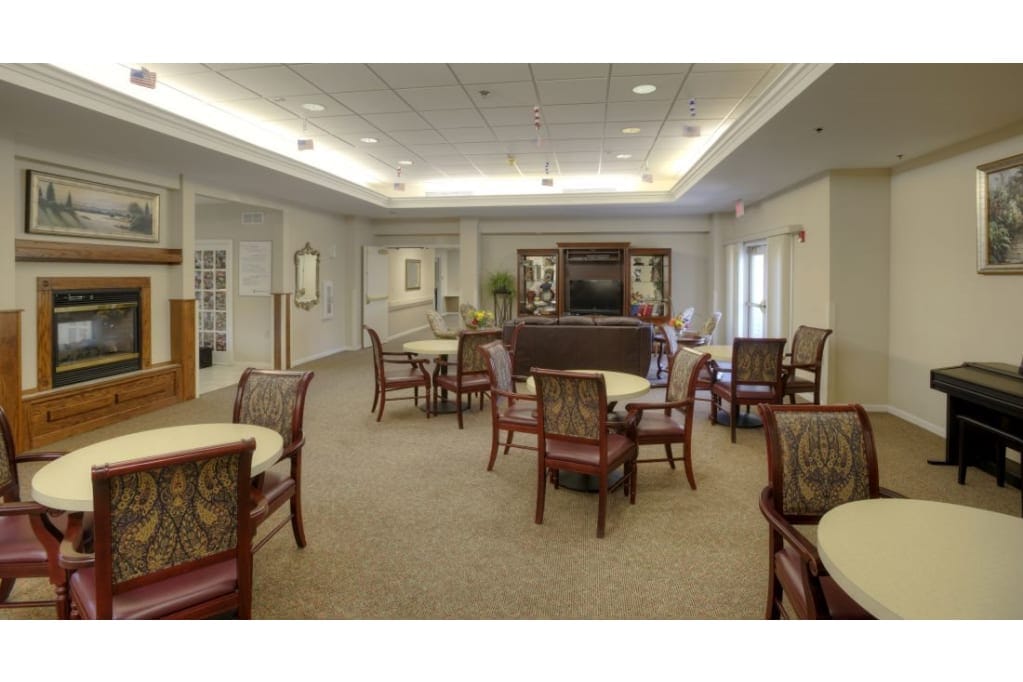 Spacious common area with seating and a fireplace