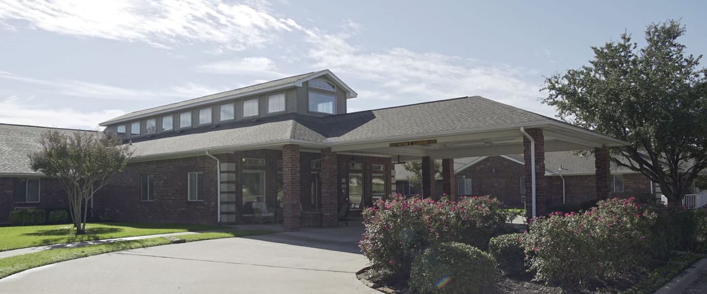 Exterior view of Brookdale Denton South building with landscaping