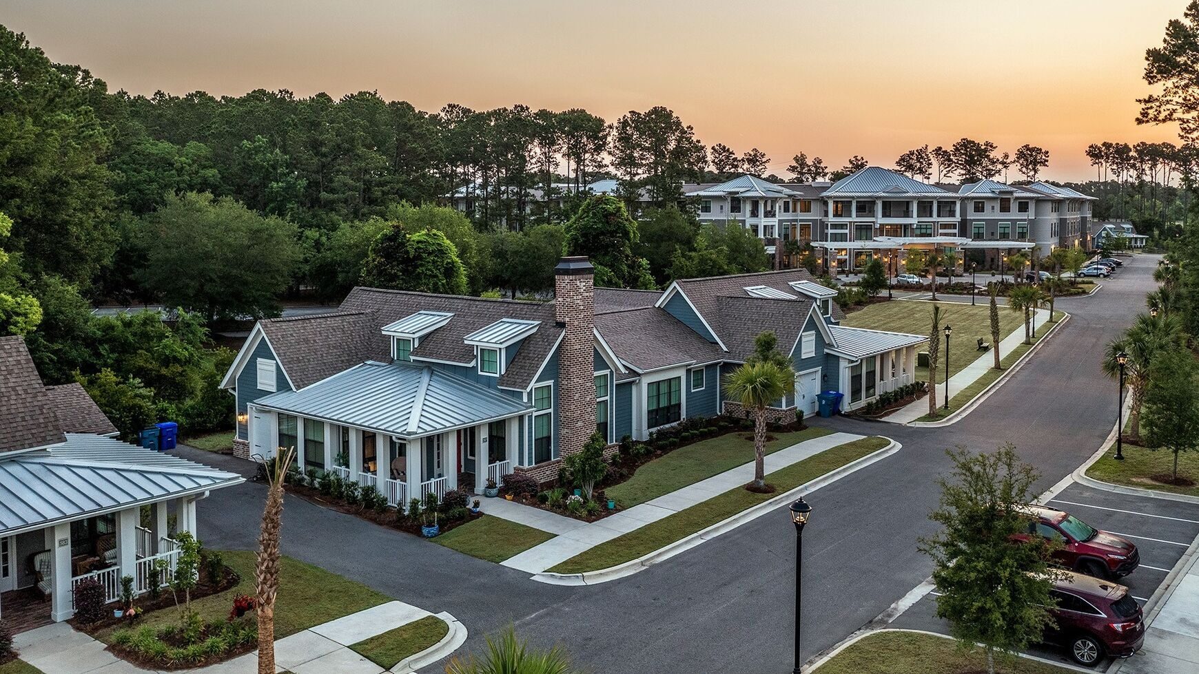 Aerial view of cottages and main building at sunset